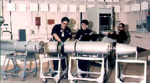 Nuclear weapons technicians disassemble a nuclear bomb in a radiologically safe manner